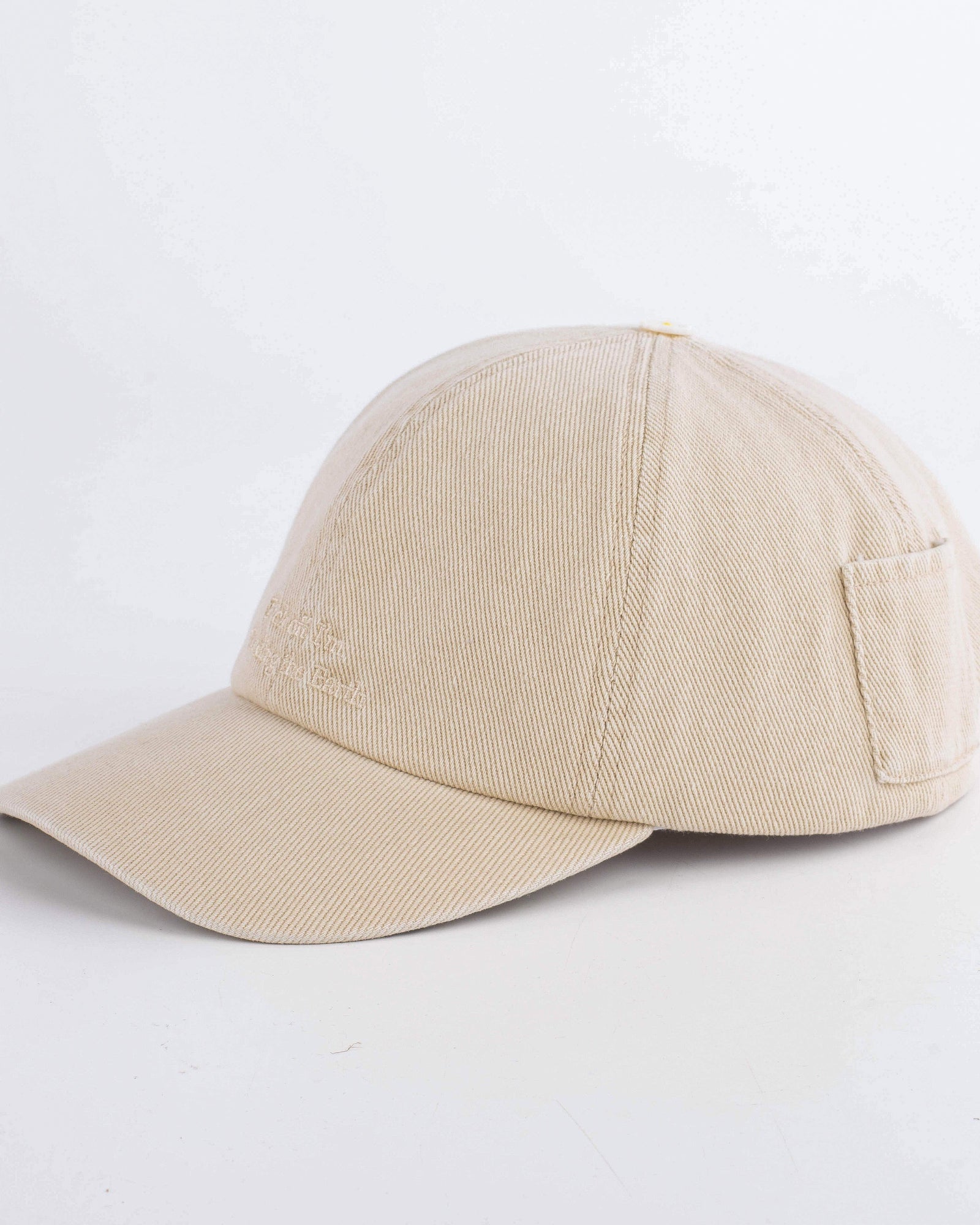 Beige baseball cap on a white background