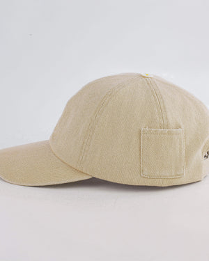 Beige baseball cap with a pocket on a light gray background