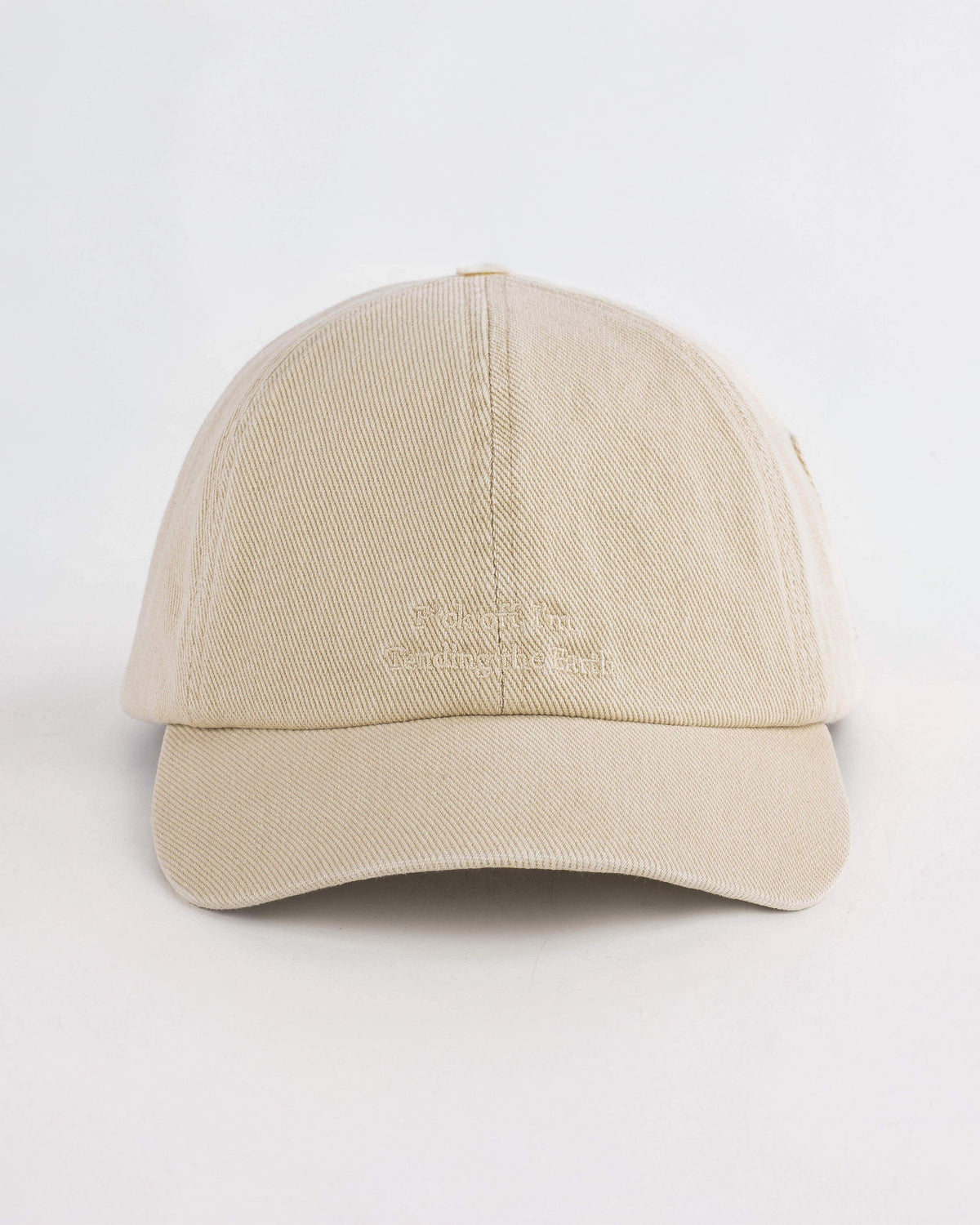 Beige baseball cap on a white background